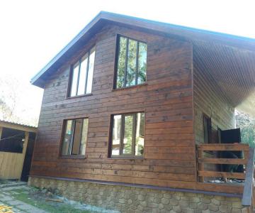 Каркасный деревянный дом с террасой, фото